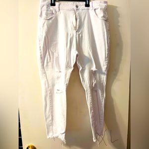 Excellent pair of white pants with holes in them.